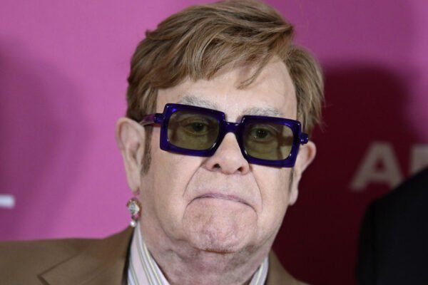 Elton John posing