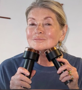 Martha Stewart holding two Lyma Laser Pros to her face.
